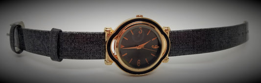 Gold plated base metal watch with black strap